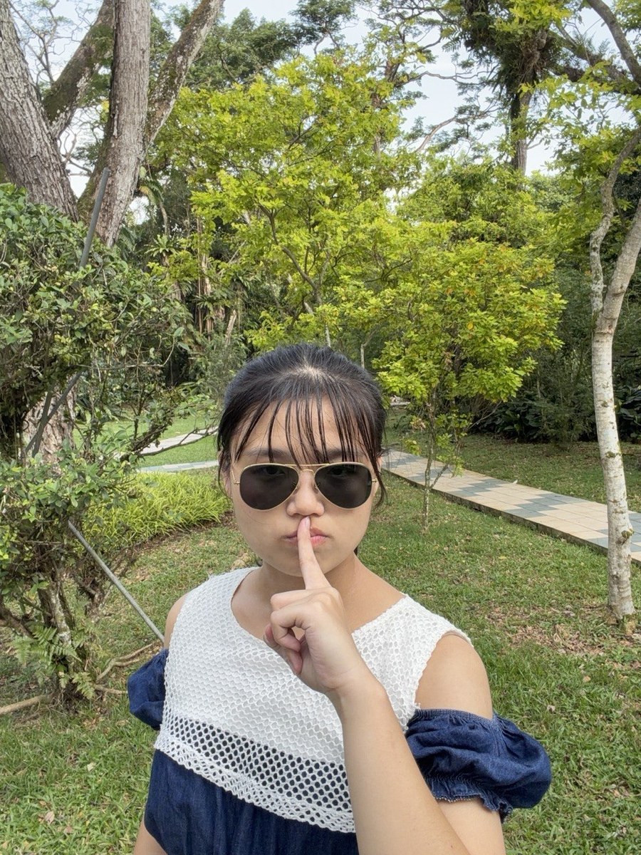 Dan wearing sunglasses in a green park