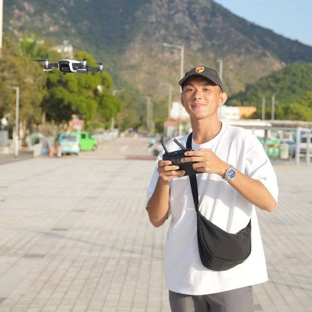 Hagen flying a drone outdoors